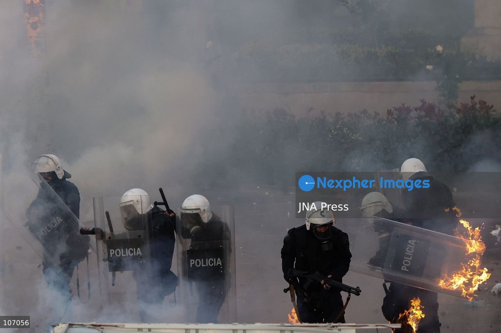 TIRANA, ALBANIA, OCTOBER 18, 2026: Demonstrators clash with riot police in Skanderbeg Square as student-led anti-government protests continue for a sixth consecutive day. Confrontations spread from the Ministry of Education to central Tirana, with protesters throwing stones and pyrotechnics while police deploy tear gas and water cannons. Demonstrators demand improved university conditions and the resignation of Prime Minister Edi Rama. (Photo by Vlasov Sulaj/JNA Press via Nexpher Images)