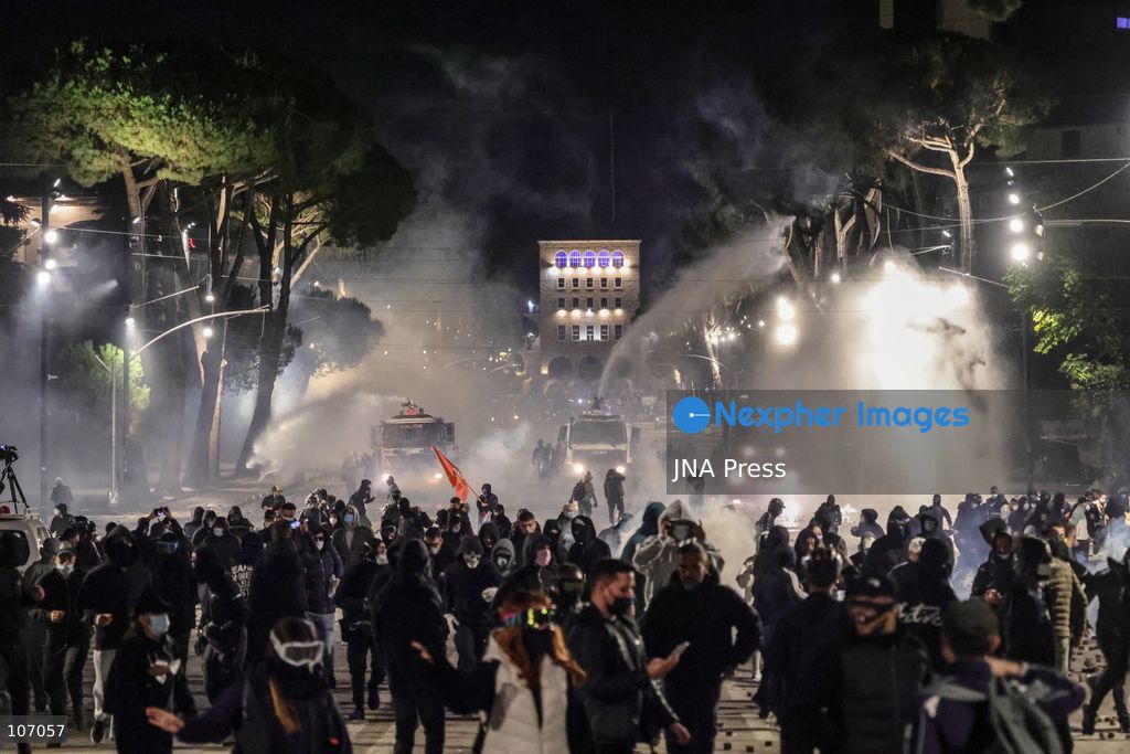 TIRANA, ALBANIA, OCTOBER 18, 2026: Demonstrators clash with riot police in Skanderbeg Square as student-led anti-government protests continue for a sixth consecutive day. Confrontations spread from the Ministry of Education to central Tirana, with protesters throwing stones and pyrotechnics while police deploy tear gas and water cannons. Demonstrators demand improved university conditions and the resignation of Prime Minister Edi Rama. (Photo by Vlasov Sulaj/JNA Press via Nexpher Images)