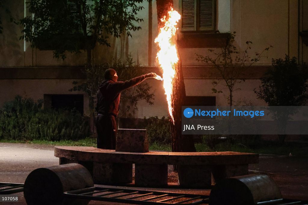 TIRANA, ALBANIA, OCTOBER 18, 2026: Demonstrators clash with riot police in Skanderbeg Square as student-led anti-government protests continue for a sixth consecutive day. Confrontations spread from the Ministry of Education to central Tirana, with protesters throwing stones and pyrotechnics while police deploy tear gas and water cannons. Demonstrators demand improved university conditions and the resignation of Prime Minister Edi Rama. (Photo by Vlasov Sulaj/JNA Press via Nexpher Images)