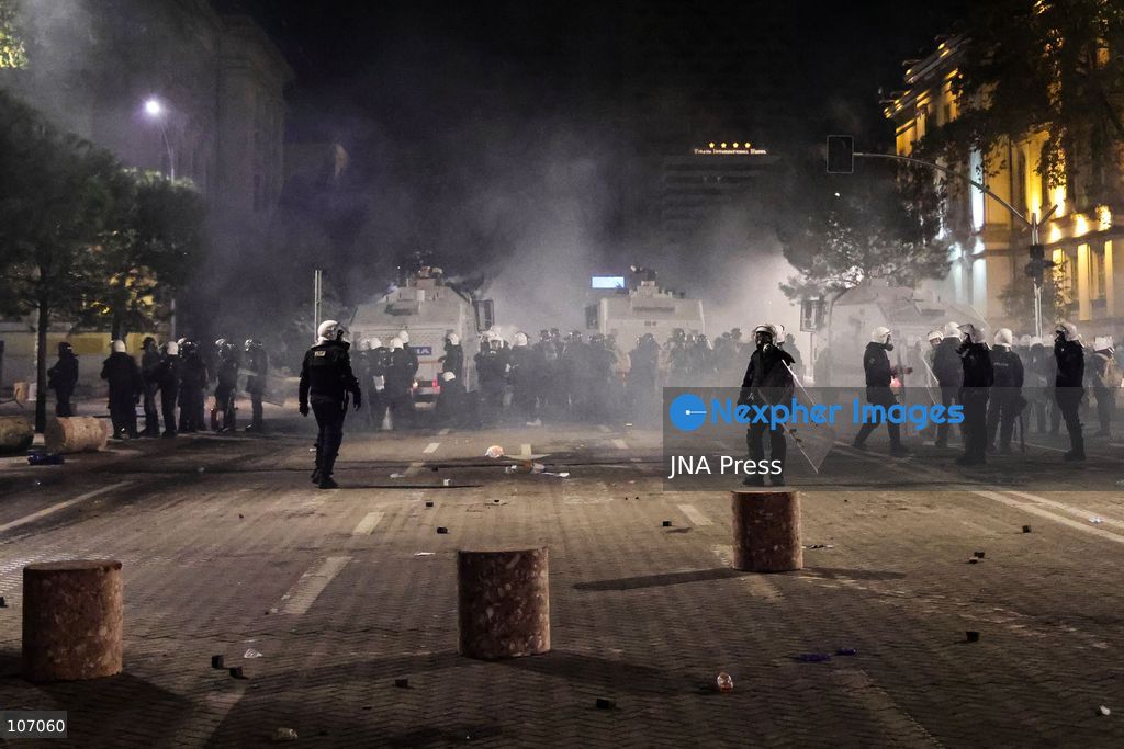 TIRANA, ALBANIA, OCTOBER 18, 2026: Demonstrators clash with riot police in Skanderbeg Square as student-led anti-government protests continue for a sixth consecutive day. Confrontations spread from the Ministry of Education to central Tirana, with protesters throwing stones and pyrotechnics while police deploy tear gas and water cannons. Demonstrators demand improved university conditions and the resignation of Prime Minister Edi Rama. (Photo by Vlasov Sulaj/JNA Press via Nexpher Images)
