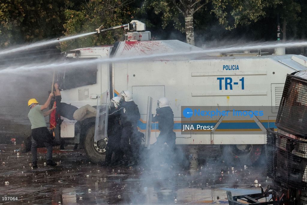 TOP PICS - TIRANA, ALBANIA, OCTOBER 18, 2026: Demonstrators clash with riot police in Skanderbeg Square as student-led anti-government protests continue for a sixth consecutive day. Confrontations spread from the Ministry of Education to central Tirana, with protesters throwing stones and pyrotechnics while police deploy tear gas and water cannons. Demonstrators demand improved university conditions and the resignation of Prime Minister Edi Rama. (Photo by Vlasov Sulaj/JNA Press via Nexpher Images)