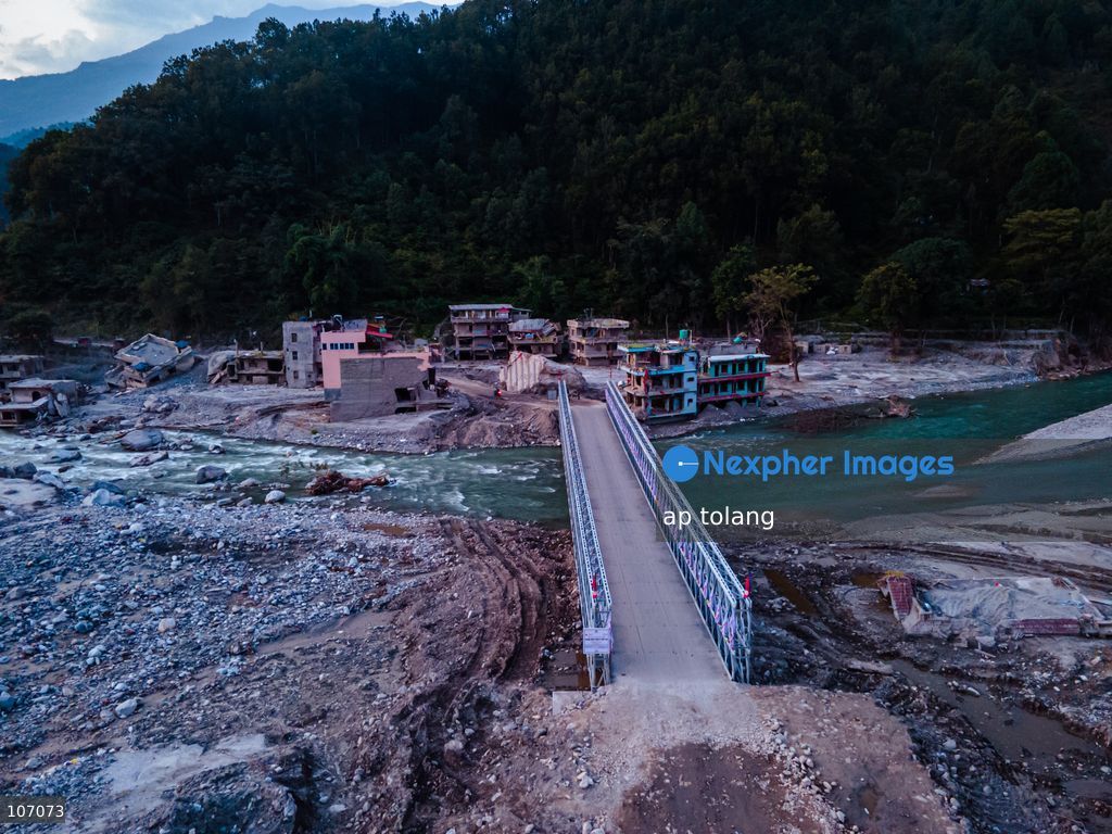 Rasuwa, NEPAL, October 14, 2026: An aerial view shows a newly installed Bailey bridge connecting the border areas of Nuwakot and Rasuwa districts in Nepal. the bridge was installed to restore road connectivity after severe flooding destroyed existing bridges on August 26, 2026. (Photo by ap tolang/Nexpher Images)