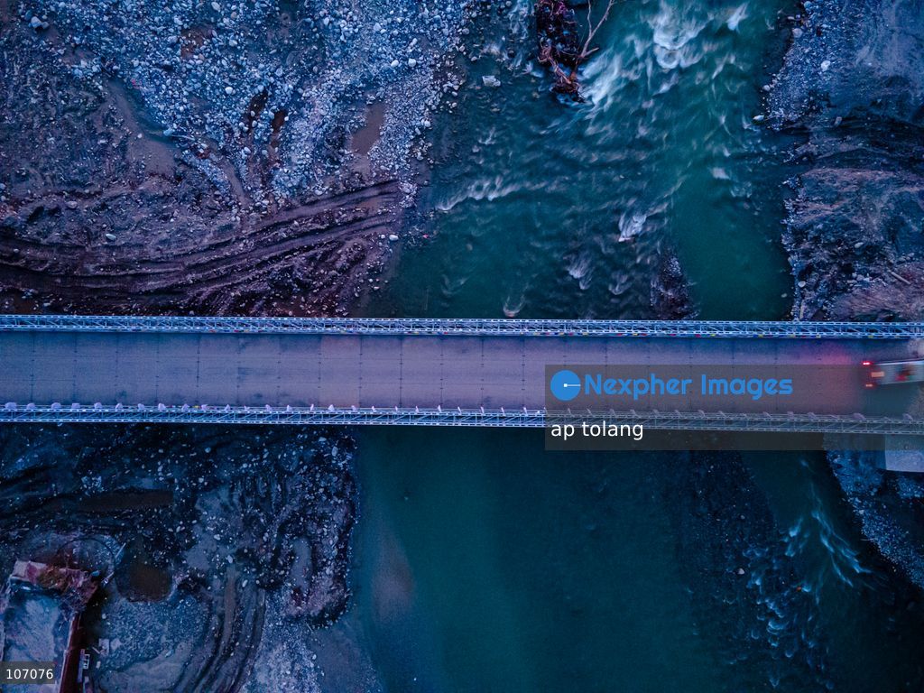 Rasuwa, NEPAL, October 14, 2026: An aerial view shows a newly installed Bailey bridge connecting the border areas of Nuwakot and Rasuwa districts in Nepal. the bridge was installed to restore road connectivity after severe flooding destroyed existing bridges on August 26, 2026. (Photo by ap tolang/Nexpher Images)
