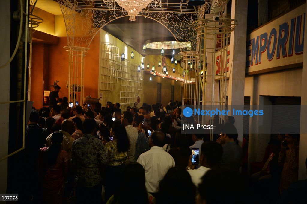 SILIGURI, INDIA - OCTOBER 19, 2026: Visitors gather at the Mitra Sammilani Puja Pandal in Siliguri. Mitra Sammilani, one of the oldest cultural organizations in Siliguri, is celebrating the centenary year of its Durga Puja. A major attraction is a replica of the Darjeeling Himalayan Railway (DHR), also known as the Toy Train, along with a recreation of the town's streets from a century ago, with figures of ordinary people traveling in bullock carts and horse-drawn carriages to attend the puja. (Photo by DIPTENDU DUTTA/JNA Press via Nexpher Images)