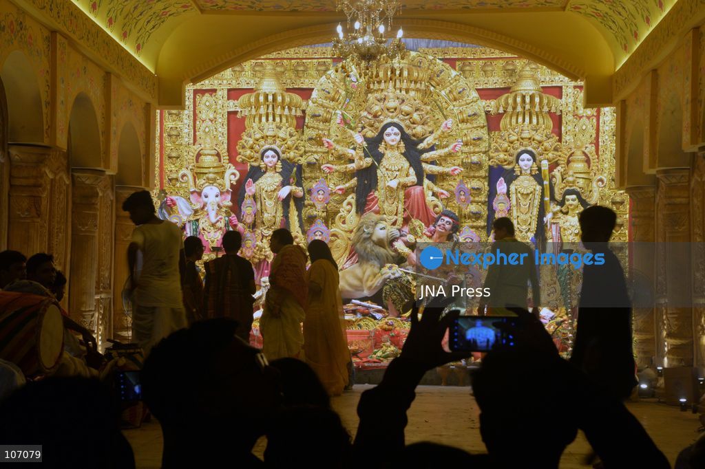SILIGURI, INDIA - OCTOBER 19, 2026: Visitors gather at the Mitra Sammilani Puja Pandal in Siliguri. Mitra Sammilani, one of the oldest cultural organizations in Siliguri, is celebrating the centenary year of its Durga Puja. A major attraction is a replica of the Darjeeling Himalayan Railway (DHR), also known as the Toy Train, along with a recreation of the town's streets from a century ago, with figures of ordinary people traveling in bullock carts and horse-drawn carriages to attend the puja. (Photo by DIPTENDU DUTTA/JNA Press via Nexpher Images)