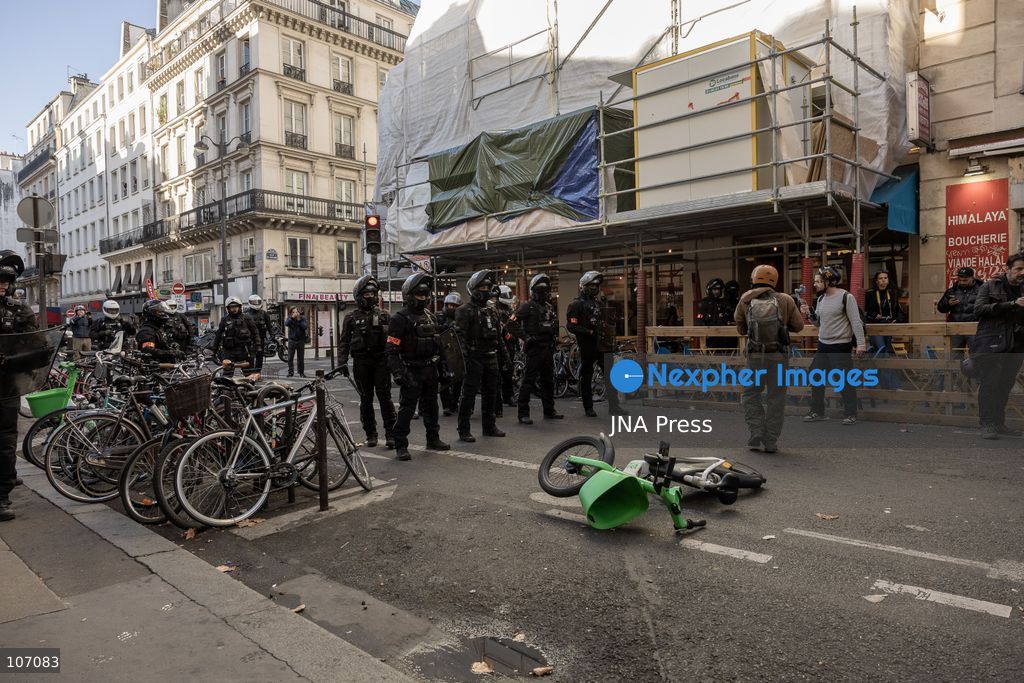 PARIS, FRANCE, OCTOBER 17, 2026: Demonstrators clash with riot police in and around Place de la République during protests against austerity and rising living costs, and in support of students demanding better school conditions. Makeshift barricades are erected and fires break out as police use tear gas and water cannons. Shops in surrounding streets are damaged and looted during the unrest. (Photo by Oualid Abdellaoui/JNA Press via Nexpher Images)