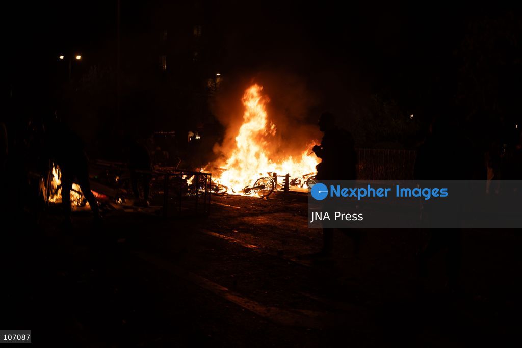 PARIS, FRANCE, OCTOBER 17, 2026: Demonstrators clash with riot police in and around Place de la République during protests against austerity and rising living costs, and in support of students demanding better school conditions. Makeshift barricades are erected and fires break out as police use tear gas and water cannons. Shops in surrounding streets are damaged and looted during the unrest. (Photo by Oualid Abdellaoui/JNA Press via Nexpher Images)
