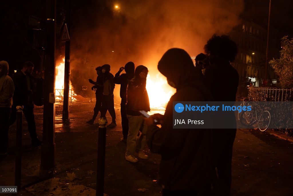 PARIS, FRANCE, OCTOBER 17, 2026: Demonstrators clash with riot police in and around Place de la République during protests against austerity and rising living costs, and in support of students demanding better school conditions. Makeshift barricades are erected and fires break out as police use tear gas and water cannons. Shops in surrounding streets are damaged and looted during the unrest. (Photo by Oualid Abdellaoui/JNA Press via Nexpher Images)
