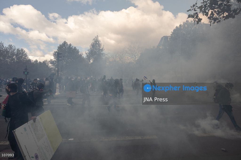 PARIS, FRANCE, OCTOBER 17, 2026: Demonstrators clash with riot police in and around Place de la République during protests against austerity and rising living costs, and in support of students demanding better school conditions. Makeshift barricades are erected and fires break out as police use tear gas and water cannons. Shops in surrounding streets are damaged and looted during the unrest. (Photo by Oualid Abdellaoui/JNA Press via Nexpher Images)