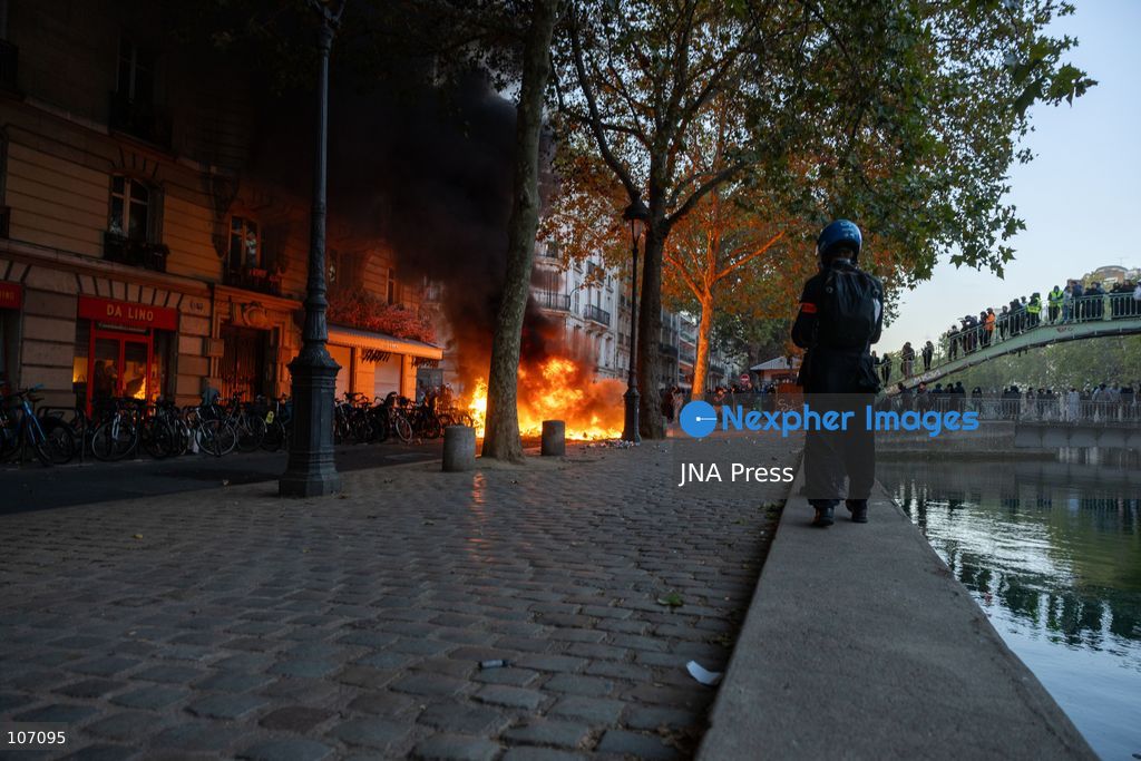 PARIS, FRANCE, OCTOBER 17, 2026: Demonstrators clash with riot police in and around Place de la République during protests against austerity and rising living costs, and in support of students demanding better school conditions. Makeshift barricades are erected and fires break out as police use tear gas and water cannons. Shops in surrounding streets are damaged and looted during the unrest. (Photo by Oualid Abdellaoui/JNA Press via Nexpher Images)