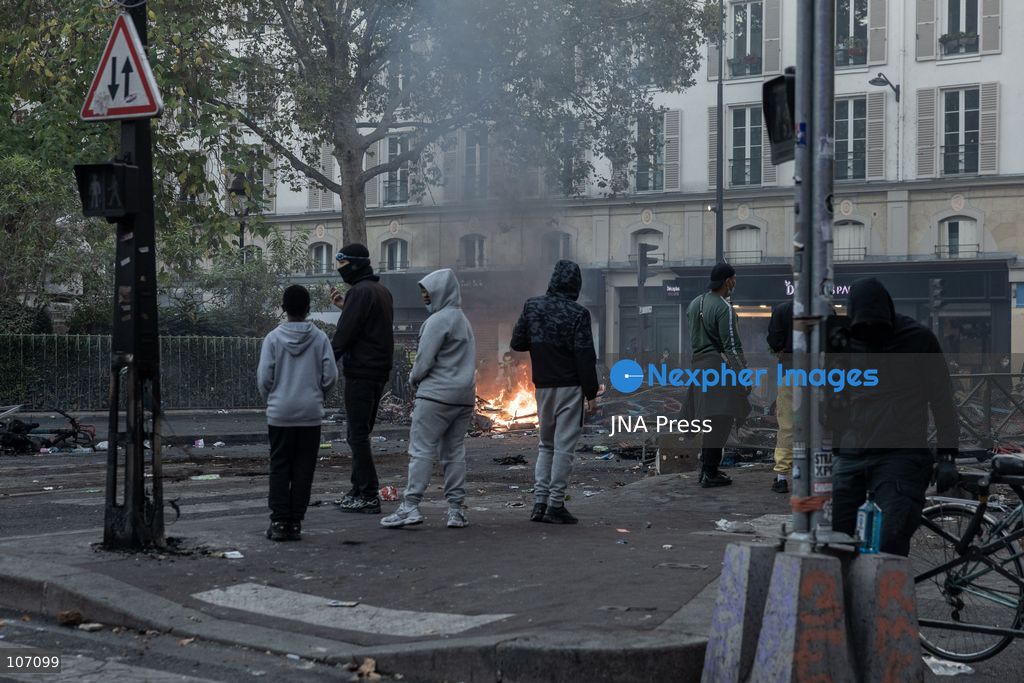 PARIS, FRANCE, OCTOBER 17, 2026: Demonstrators clash with riot police in and around Place de la République during protests against austerity and rising living costs, and in support of students demanding better school conditions. Makeshift barricades are erected and fires break out as police use tear gas and water cannons. Shops in surrounding streets are damaged and looted during the unrest. (Photo by Oualid Abdellaoui/JNA Press via Nexpher Images)