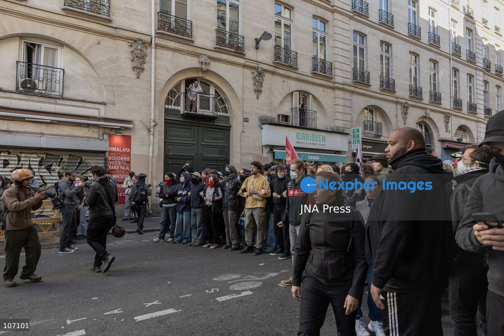 PARIS, FRANCE, OCTOBER 17, 2026: Demonstrators clash with riot police in and around Place de la République during protests against austerity and rising living costs, and in support of students demanding better school conditions. Makeshift barricades are erected and fires break out as police use tear gas and water cannons. Shops in surrounding streets are damaged and looted during the unrest. (Photo by Oualid Abdellaoui/JNA Press via Nexpher Images)