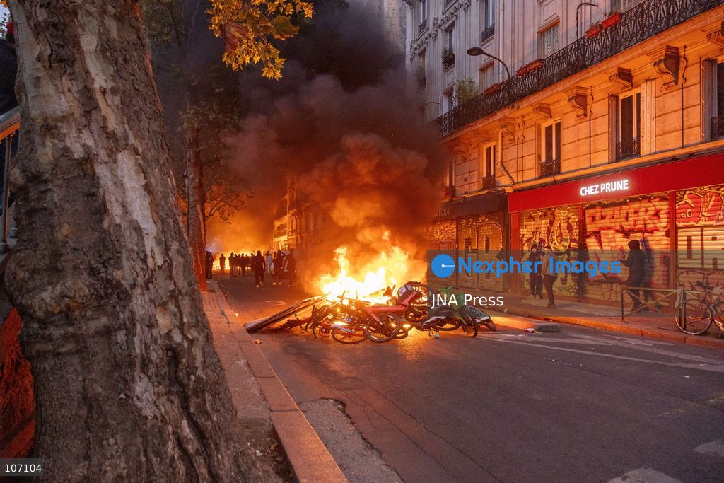PARIS, FRANCE, OCTOBER 17, 2026: Demonstrators clash with riot police in and around Place de la République during protests against austerity and rising living costs, and in support of students demanding better school conditions. Makeshift barricades are erected and fires break out as police use tear gas and water cannons. Shops in surrounding streets are damaged and looted during the unrest. (Photo by Oualid Abdellaoui/JNA Press via Nexpher Images)