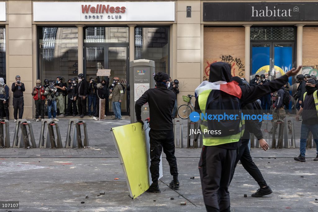 PARIS, FRANCE, OCTOBER 17, 2026: Demonstrators clash with riot police in and around Place de la République during protests against austerity and rising living costs, and in support of students demanding better school conditions. Makeshift barricades are erected and fires break out as police use tear gas and water cannons. Shops in surrounding streets are damaged and looted during the unrest. (Photo by Oualid Abdellaoui/JNA Press via Nexpher Images)