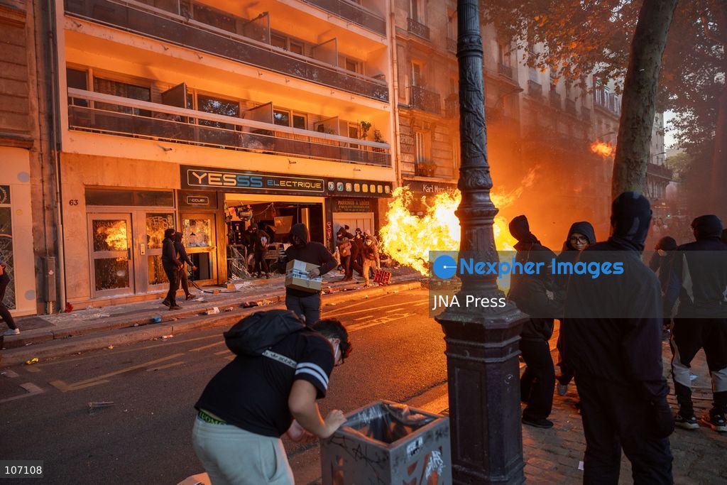 PARIS, FRANCE, OCTOBER 17, 2026: Demonstrators clash with riot police in and around Place de la République during protests against austerity and rising living costs, and in support of students demanding better school conditions. Makeshift barricades are erected and fires break out as police use tear gas and water cannons. Shops in surrounding streets are damaged and looted during the unrest. (Photo by Oualid Abdellaoui/JNA Press via Nexpher Images)