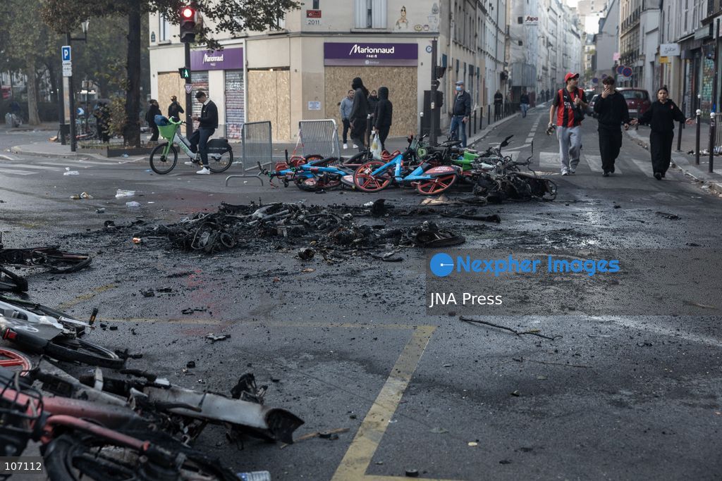 PARIS, FRANCE, OCTOBER 17, 2026: Demonstrators clash with riot police in and around Place de la République during protests against austerity and rising living costs, and in support of students demanding better school conditions. Makeshift barricades are erected and fires break out as police use tear gas and water cannons. Shops in surrounding streets are damaged and looted during the unrest. (Photo by Oualid Abdellaoui/JNA Press via Nexpher Images)