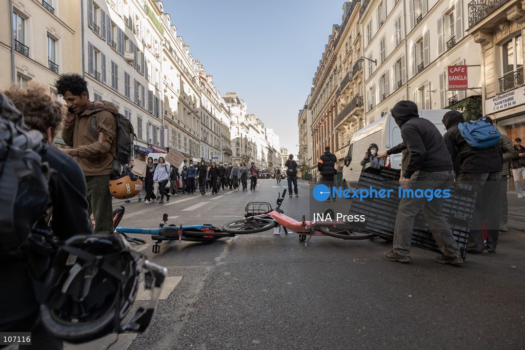 PARIS, FRANCE, OCTOBER 17, 2026: Demonstrators clash with riot police in and around Place de la République during protests against austerity and rising living costs, and in support of students demanding better school conditions. Makeshift barricades are erected and fires break out as police use tear gas and water cannons. Shops in surrounding streets are damaged and looted during the unrest. (Photo by Oualid Abdellaoui/JNA Press via Nexpher Images)