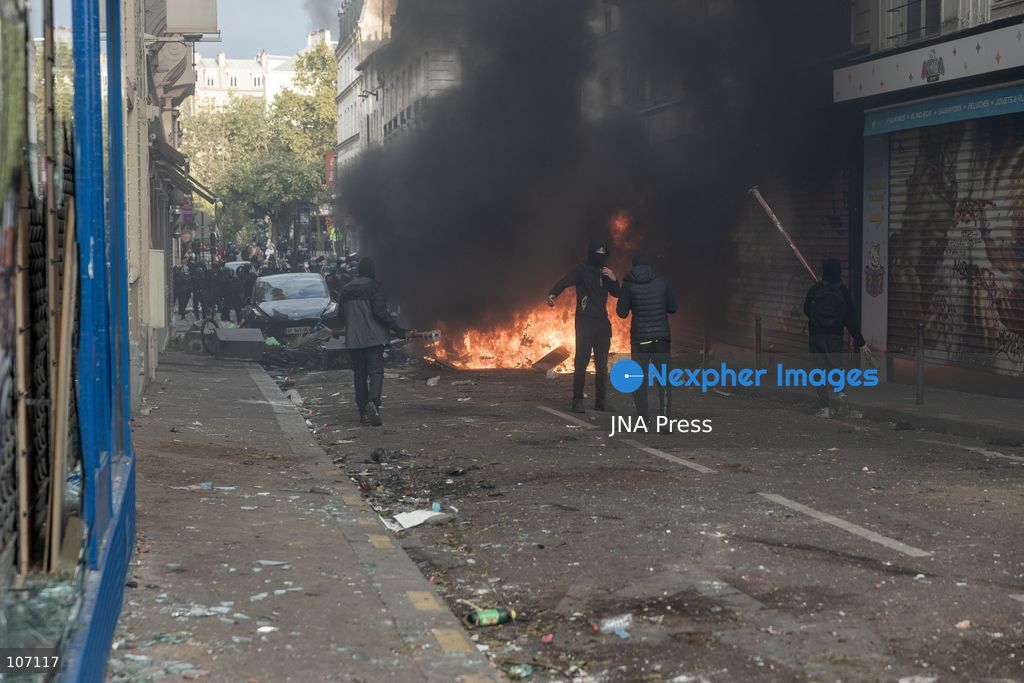PARIS, FRANCE, OCTOBER 17, 2026: Demonstrators clash with riot police in and around Place de la République during protests against austerity and rising living costs, and in support of students demanding better school conditions. Makeshift barricades are erected and fires break out as police use tear gas and water cannons. Shops in surrounding streets are damaged and looted during the unrest. (Photo by Oualid Abdellaoui/JNA Press via Nexpher Images)