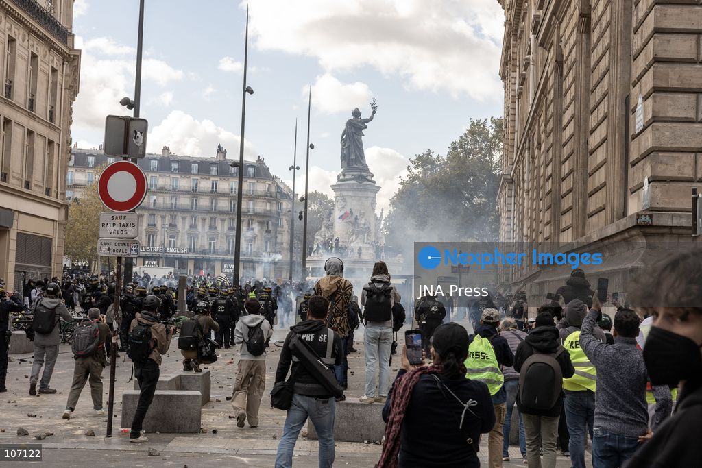 PARIS, FRANCE, OCTOBER 17, 2026: Demonstrators clash with riot police in and around Place de la République during protests against austerity and rising living costs, and in support of students demanding better school conditions. Makeshift barricades are erected and fires break out as police use tear gas and water cannons. Shops in surrounding streets are damaged and looted during the unrest. (Photo by Oualid Abdellaoui/JNA Press via Nexpher Images)