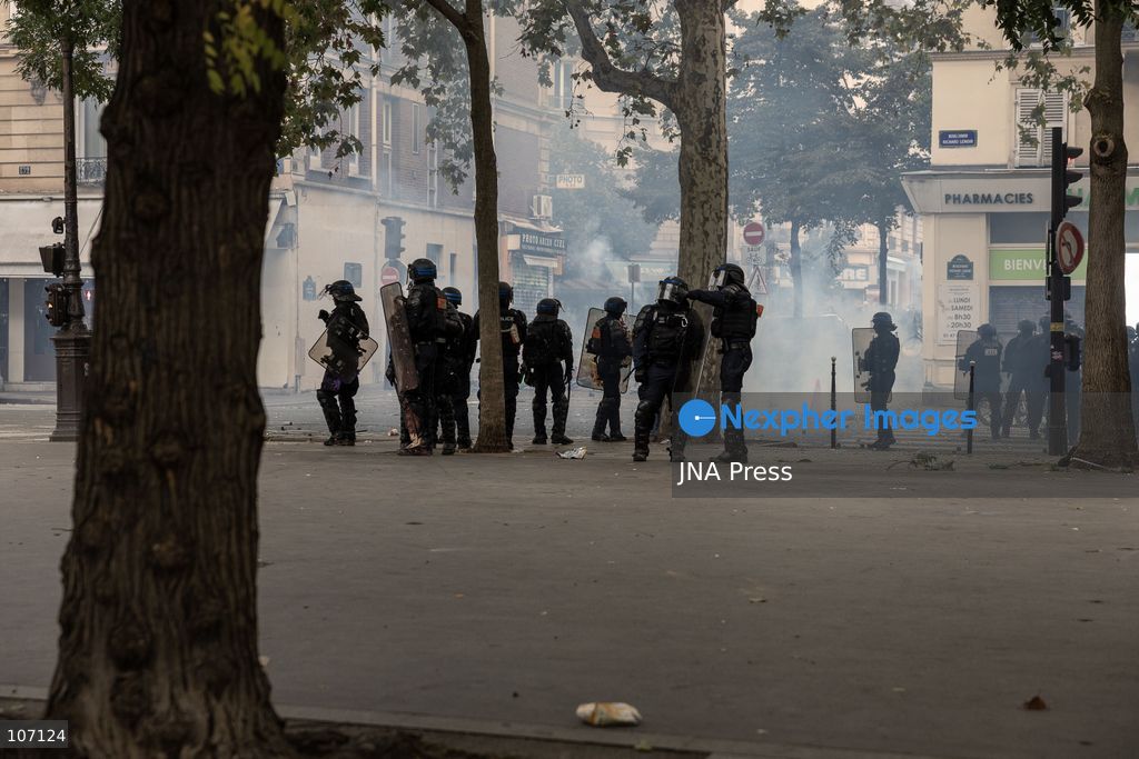 PARIS, FRANCE, OCTOBER 17, 2026: Demonstrators clash with riot police in and around Place de la République during protests against austerity and rising living costs, and in support of students demanding better school conditions. Makeshift barricades are erected and fires break out as police use tear gas and water cannons. Shops in surrounding streets are damaged and looted during the unrest. (Photo by Oualid Abdellaoui/JNA Press via Nexpher Images)