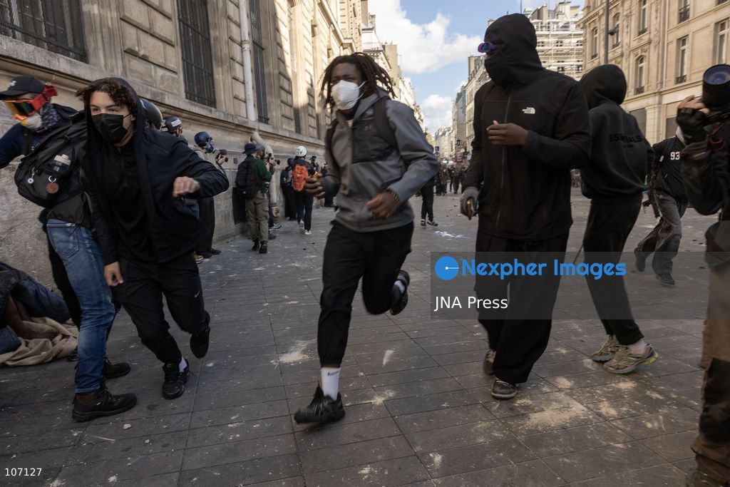 PARIS, FRANCE, OCTOBER 17, 2026: Demonstrators clash with riot police in and around Place de la République during protests against austerity and rising living costs, and in support of students demanding better school conditions. Makeshift barricades are erected and fires break out as police use tear gas and water cannons. Shops in surrounding streets are damaged and looted during the unrest. (Photo by Oualid Abdellaoui/JNA Press via Nexpher Images)