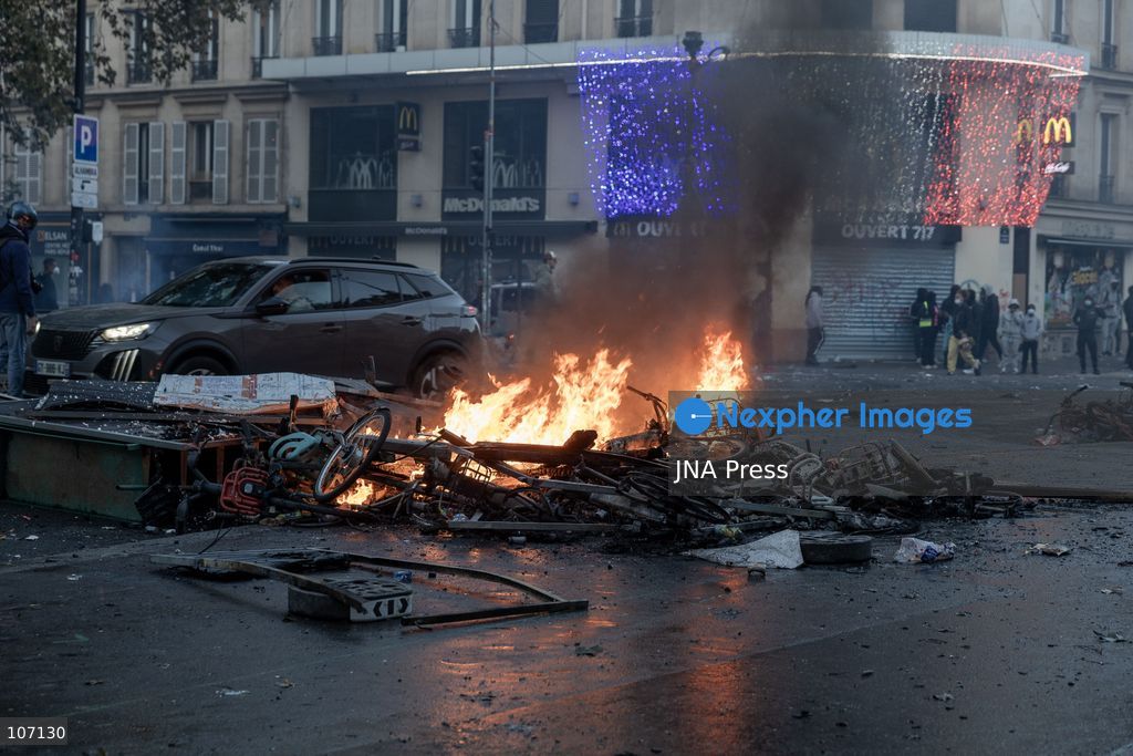 PARIS, FRANCE, OCTOBER 17, 2026: Demonstrators clash with riot police in and around Place de la République during protests against austerity and rising living costs, and in support of students demanding better school conditions. Makeshift barricades are erected and fires break out as police use tear gas and water cannons. Shops in surrounding streets are damaged and looted during the unrest. (Photo by Oualid Abdellaoui/JNA Press via Nexpher Images)