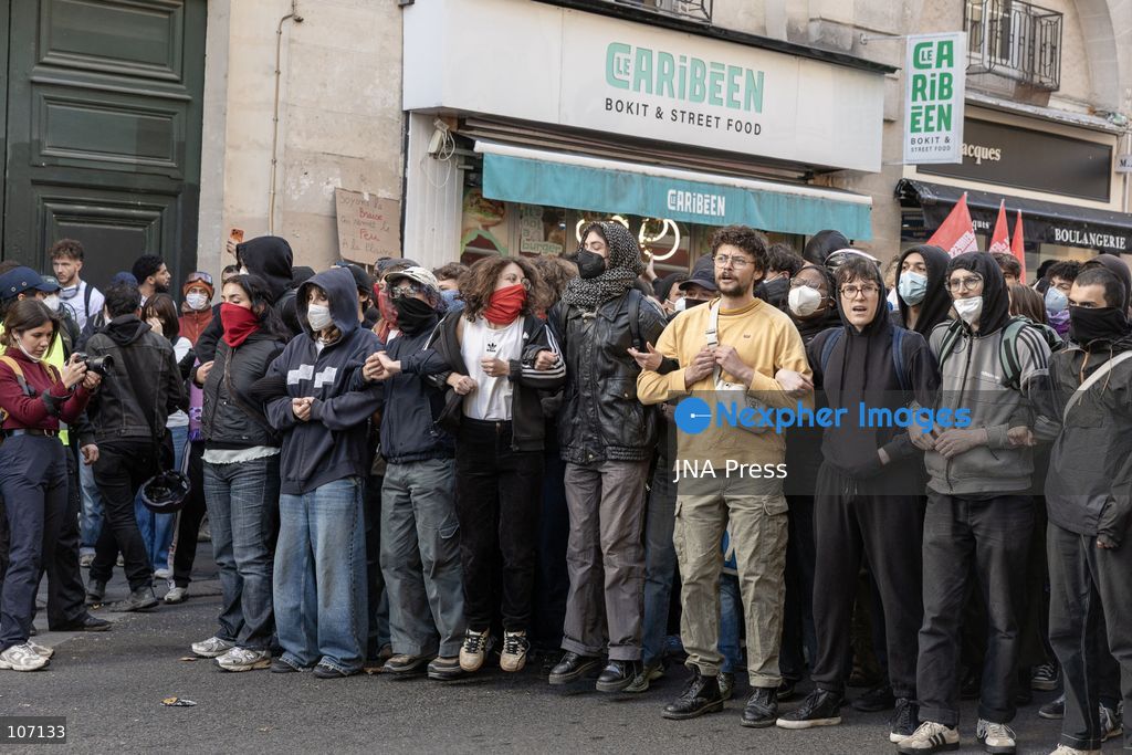 PARIS, FRANCE, OCTOBER 17, 2026: Demonstrators clash with riot police in and around Place de la République during protests against austerity and rising living costs, and in support of students demanding better school conditions. Makeshift barricades are erected and fires break out as police use tear gas and water cannons. Shops in surrounding streets are damaged and looted during the unrest. (Photo by Oualid Abdellaoui/JNA Press via Nexpher Images)