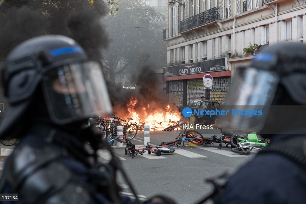 PARIS, FRANCE, OCTOBER 17, 2026: Demonstrators clash with riot police in and around Place de la République during protests against austerity and rising living costs, and in support of students demanding better school conditions. Makeshift barricades are erected and fires break out as police use tear gas and water cannons. Shops in surrounding streets are damaged and looted during the unrest. (Photo by Oualid Abdellaoui/JNA Press via Nexpher Images)