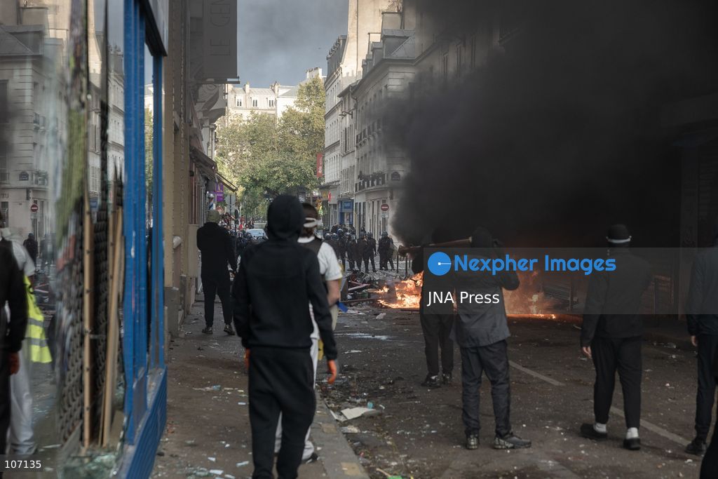 PARIS, FRANCE, OCTOBER 17, 2026: Demonstrators clash with riot police in and around Place de la République during protests against austerity and rising living costs, and in support of students demanding better school conditions. Makeshift barricades are erected and fires break out as police use tear gas and water cannons. Shops in surrounding streets are damaged and looted during the unrest. (Photo by Oualid Abdellaoui/JNA Press via Nexpher Images)