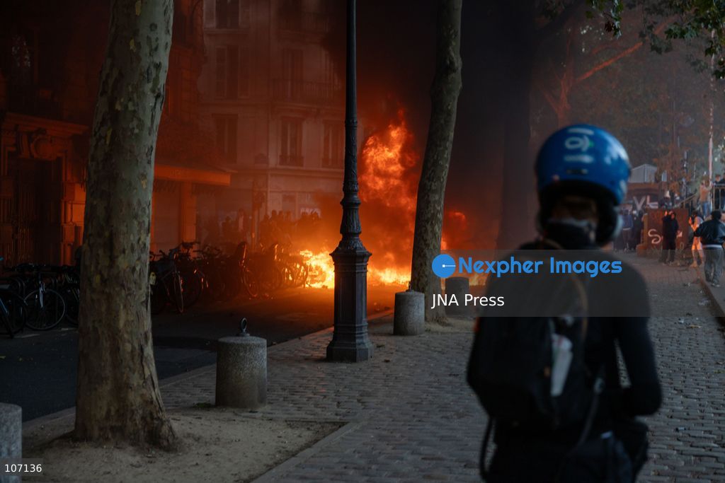 PARIS, FRANCE, OCTOBER 17, 2026: Demonstrators clash with riot police in and around Place de la République during protests against austerity and rising living costs, and in support of students demanding better school conditions. Makeshift barricades are erected and fires break out as police use tear gas and water cannons. Shops in surrounding streets are damaged and looted during the unrest. (Photo by Oualid Abdellaoui/JNA Press via Nexpher Images)