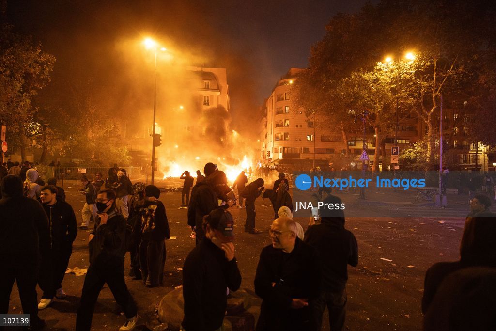 PARIS, FRANCE, OCTOBER 17, 2026: Demonstrators clash with riot police in and around Place de la République during protests against austerity and rising living costs, and in support of students demanding better school conditions. Makeshift barricades are erected and fires break out as police use tear gas and water cannons. Shops in surrounding streets are damaged and looted during the unrest. (Photo by Oualid Abdellaoui/JNA Press via Nexpher Images)
