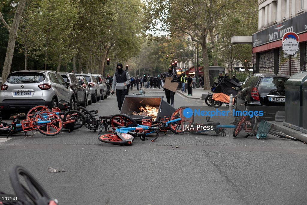 PARIS, FRANCE, OCTOBER 17, 2026: Demonstrators clash with riot police in and around Place de la République during protests against austerity and rising living costs, and in support of students demanding better school conditions. Makeshift barricades are erected and fires break out as police use tear gas and water cannons. Shops in surrounding streets are damaged and looted during the unrest. (Photo by Oualid Abdellaoui/JNA Press via Nexpher Images)