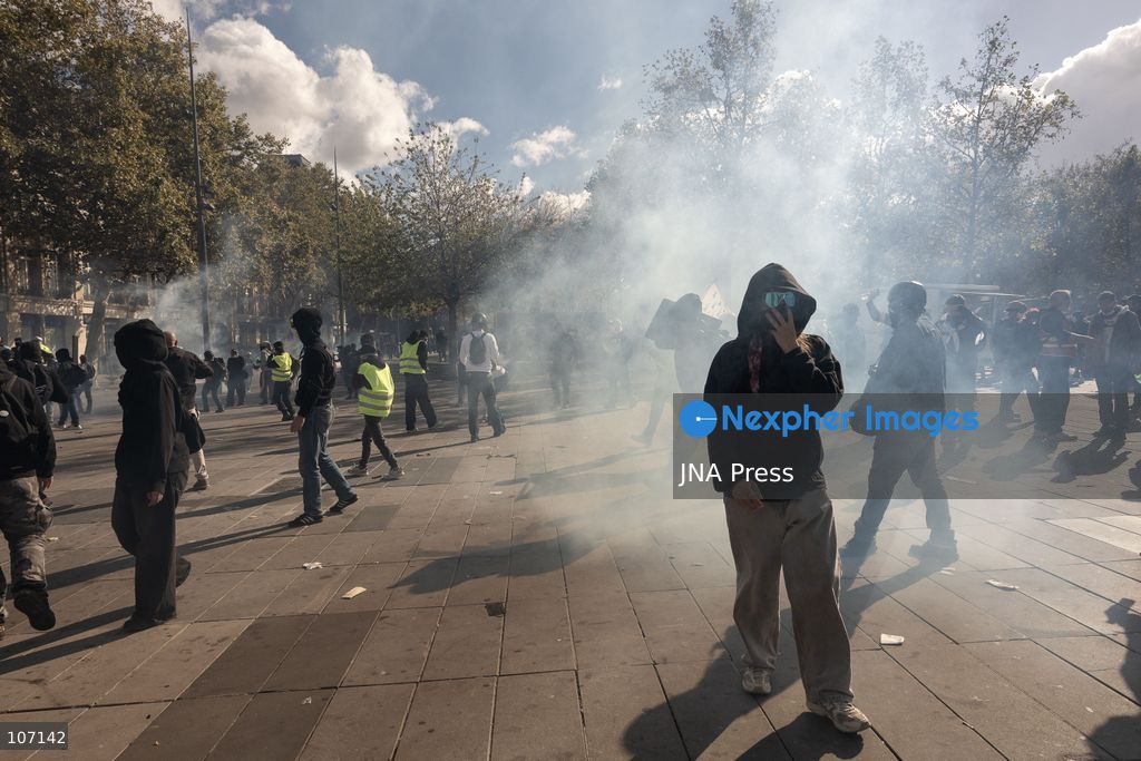 PARIS, FRANCE, OCTOBER 17, 2026: Demonstrators clash with riot police in and around Place de la République during protests against austerity and rising living costs, and in support of students demanding better school conditions. Makeshift barricades are erected and fires break out as police use tear gas and water cannons. Shops in surrounding streets are damaged and looted during the unrest. (Photo by Oualid Abdellaoui/JNA Press via Nexpher Images)