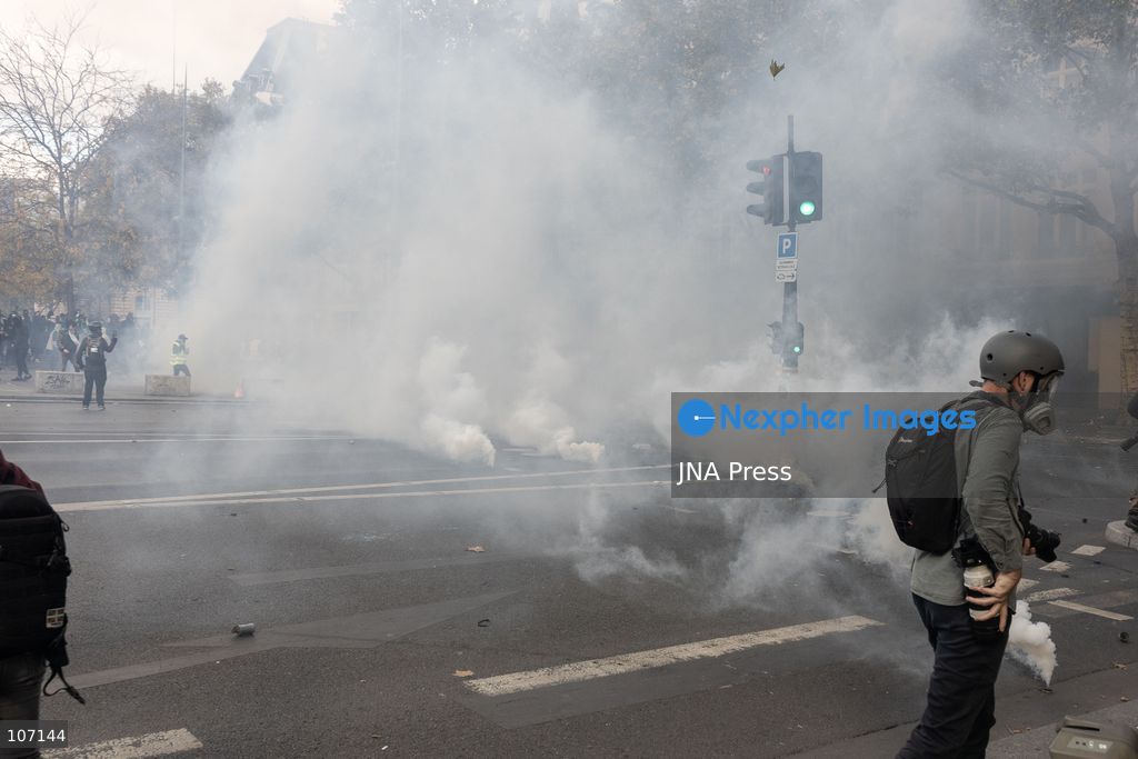 PARIS, FRANCE, OCTOBER 17, 2026: Demonstrators clash with riot police in and around Place de la République during protests against austerity and rising living costs, and in support of students demanding better school conditions. Makeshift barricades are erected and fires break out as police use tear gas and water cannons. Shops in surrounding streets are damaged and looted during the unrest. (Photo by Oualid Abdellaoui/JNA Press via Nexpher Images)