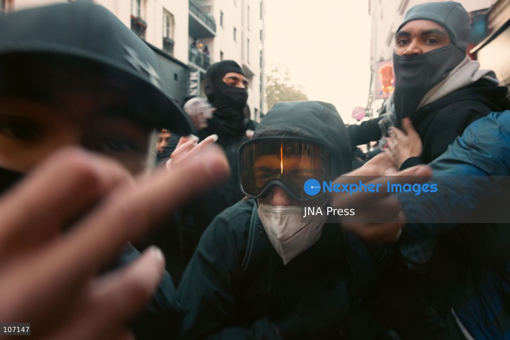 PARIS, FRANCE - OCTOBER 18, 2026: Protesters clash with police near Place de la République in Paris during a protest against austerity. Protesters set up makeshift barricades and start fires in the square and surrounding streets. After police clear the square, protesters attack nearby shops. (Photo by Oualid Abdellaoui/JNA Press via Nexpher Images)