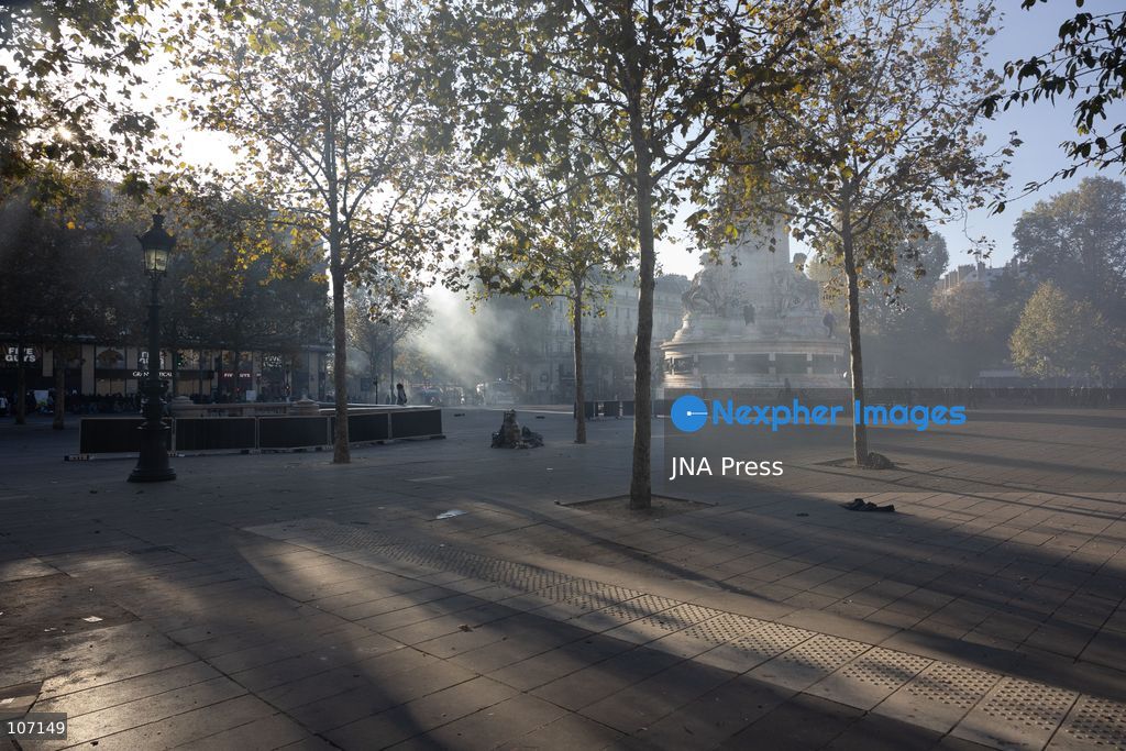 PARIS, FRANCE - OCTOBER 18, 2026: Protesters clash with police near Place de la République in Paris during a protest against austerity. Protesters set up makeshift barricades and start fires in the square and surrounding streets. After police clear the square, protesters attack nearby shops. (Photo by Oualid Abdellaoui/JNA Press via Nexpher Images)