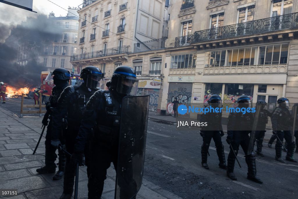PARIS, FRANCE - OCTOBER 18, 2026: Protesters clash with police near Place de la République in Paris during a protest against austerity. Protesters set up makeshift barricades and start fires in the square and surrounding streets. After police clear the square, protesters attack nearby shops. (Photo by Oualid Abdellaoui/JNA Press via Nexpher Images)