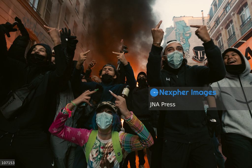PARIS, FRANCE - OCTOBER 18, 2026: Protesters clash with police near Place de la République in Paris during a protest against austerity. Protesters set up makeshift barricades and start fires in the square and surrounding streets. After police clear the square, protesters attack nearby shops. (Photo by Oualid Abdellaoui/JNA Press via Nexpher Images)