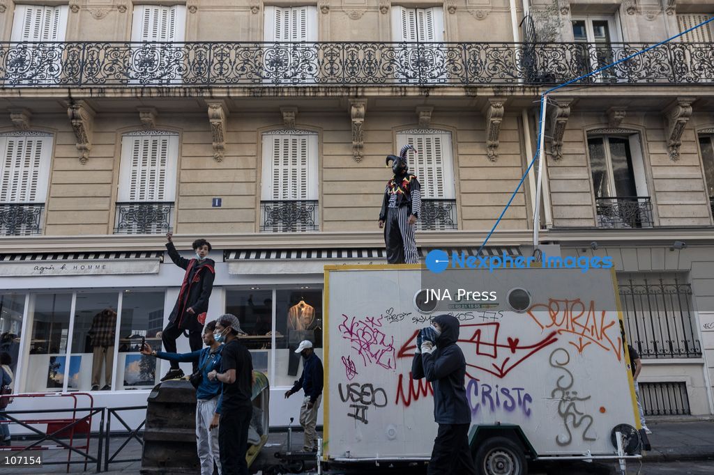 PARIS, FRANCE - OCTOBER 18, 2026: Protesters clash with police near Place de la République in Paris during a protest against austerity. Protesters set up makeshift barricades and start fires in the square and surrounding streets. After police clear the square, protesters attack nearby shops. (Photo by Oualid Abdellaoui/JNA Press via Nexpher Images)