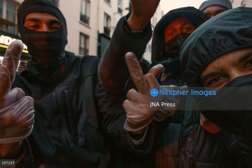 PARIS, FRANCE - OCTOBER 18, 2026: Protesters clash with police near Place de la République in Paris during a protest against austerity. Protesters set up makeshift barricades and start fires in the square and surrounding streets. After police clear the square, protesters attack nearby shops. (Photo by Oualid Abdellaoui/JNA Press via Nexpher Images)