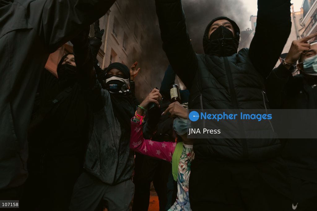 PARIS, FRANCE - OCTOBER 18, 2026: Protesters clash with police near Place de la République in Paris during a protest against austerity. Protesters set up makeshift barricades and start fires in the square and surrounding streets. After police clear the square, protesters attack nearby shops. (Photo by Oualid Abdellaoui/JNA Press via Nexpher Images)