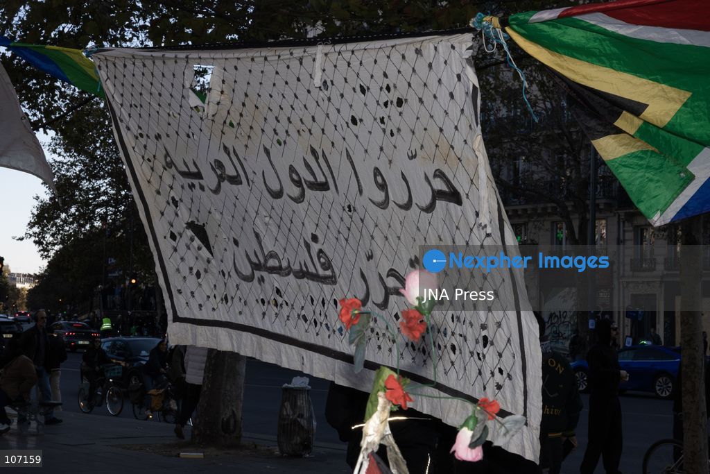 PARIS, FRANCE - OCTOBER 18, 2026: Protesters clash with police near Place de la République in Paris during a protest against austerity. Protesters set up makeshift barricades and start fires in the square and surrounding streets. After police clear the square, protesters attack nearby shops. (Photo by Oualid Abdellaoui/JNA Press via Nexpher Images)