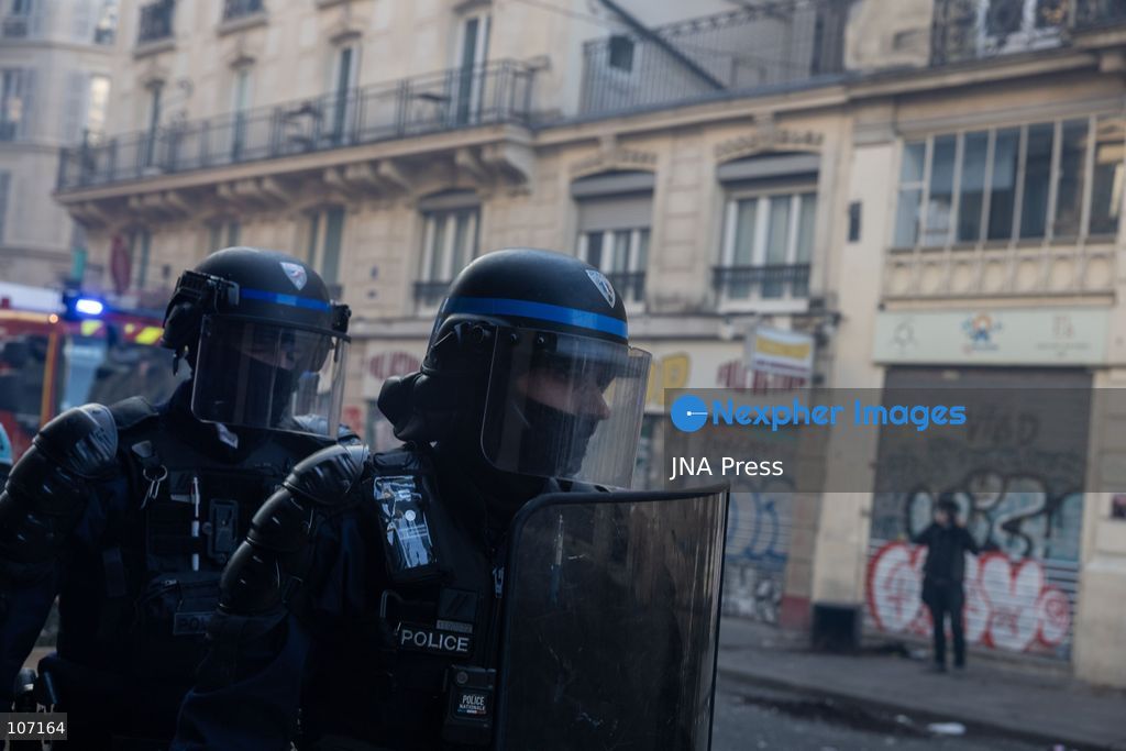 PARIS, FRANCE - OCTOBER 18, 2026: Protesters clash with police near Place de la République in Paris during a protest against austerity. Protesters set up makeshift barricades and start fires in the square and surrounding streets. After police clear the square, protesters attack nearby shops. (Photo by Oualid Abdellaoui/JNA Press via Nexpher Images)