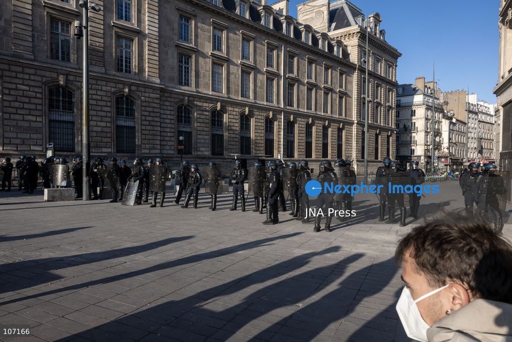 PARIS, FRANCE - OCTOBER 18, 2026: Protesters clash with police near Place de la République in Paris during a protest against austerity. Protesters set up makeshift barricades and start fires in the square and surrounding streets. After police clear the square, protesters attack nearby shops. (Photo by Oualid Abdellaoui/JNA Press via Nexpher Images)