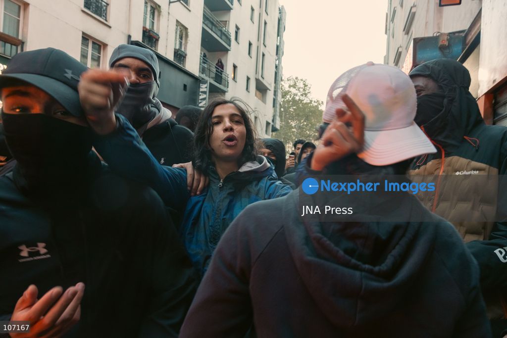 PARIS, FRANCE - OCTOBER 18, 2026: Protesters clash with police near Place de la République in Paris during a protest against austerity. Protesters set up makeshift barricades and start fires in the square and surrounding streets. After police clear the square, protesters attack nearby shops. (Photo by Oualid Abdellaoui/JNA Press via Nexpher Images)