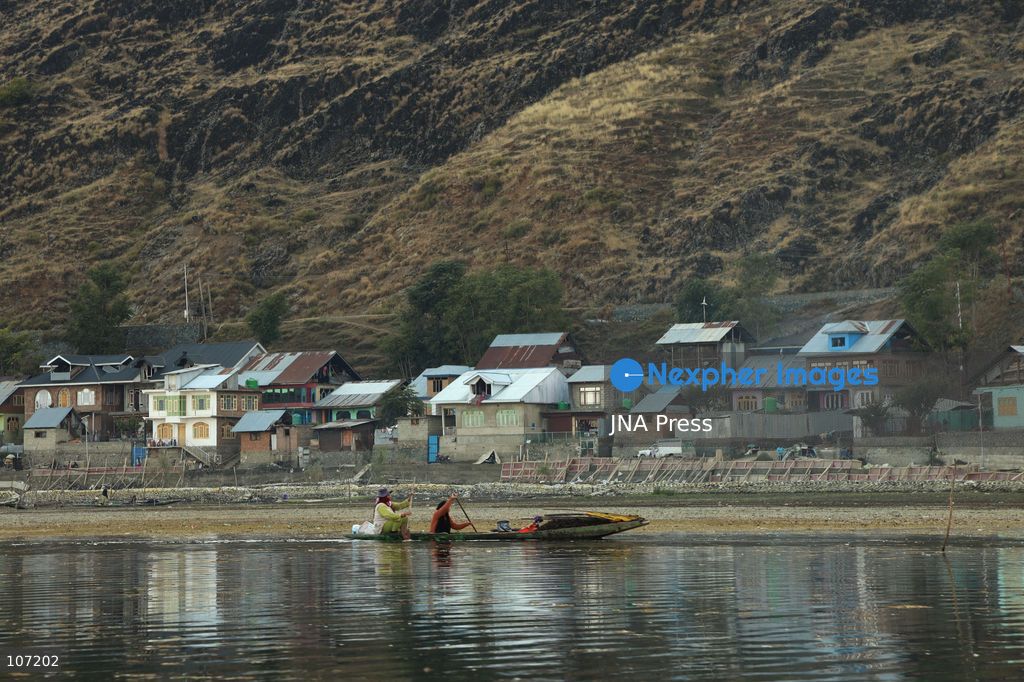 BANDIPORA, INDIA - OCTOBER 19, 2026: Fishermen cast their nets while women and other workers collect water chestnuts at Wular Lake in Bandipora district of Kashmir. Many families in the area earn their livelihoods from the lake's waters. (Photo by Kamran Yousuf/JNA Press via Nexpher Images)