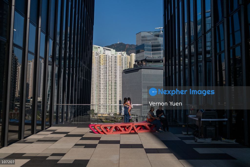 A woman holding a kid looking at buildings on October 19, 2026 in Hong Kong. (Photo by Vernon Yuen/Nexpher Images)