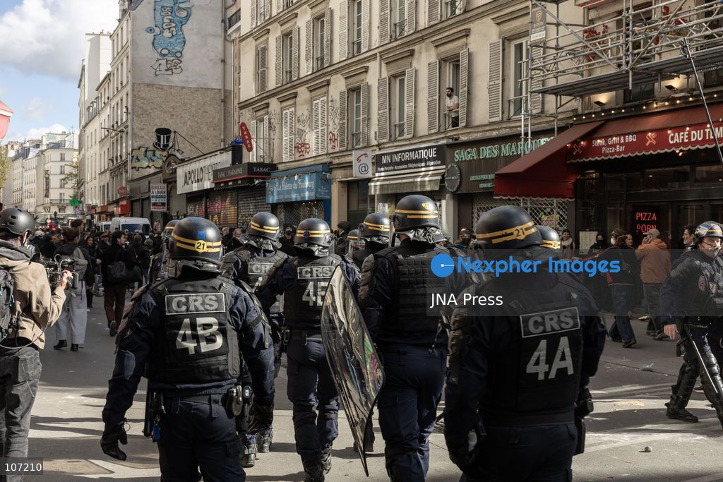 TOP PICS - PARIS, FRANCE, OCTOBER 17, 2026: Demonstrators clash with riot police in and around Place de la République during protests against austerity and rising living costs, and in support of students demanding better school conditions. Makeshift barricades are erected and fires break out as police use tear gas and water cannons. Shops in surrounding streets are damaged and looted during the unrest. (Photo by Oualid Abdellaoui/JNA Press via Nexpher Images)