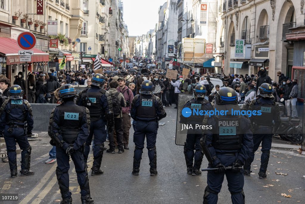 TOP PICS - PARIS, FRANCE, OCTOBER 17, 2026: Demonstrators clash with riot police in and around Place de la République during protests against austerity and rising living costs, and in support of students demanding better school conditions. Makeshift barricades are erected and fires break out as police use tear gas and water cannons. Shops in surrounding streets are damaged and looted during the unrest. (Photo by Oualid Abdellaoui/JNA Press via Nexpher Images)