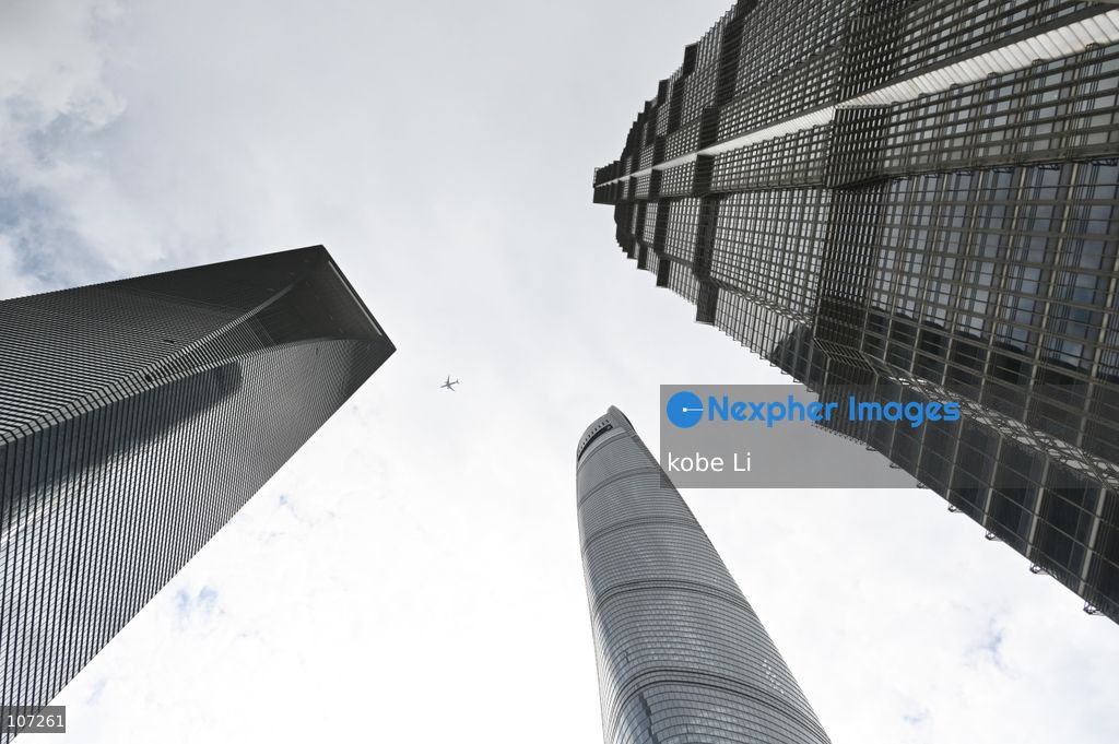 A general view showing Shanghai Tower, Shanghai World Financial Center and Jin Mao Tower, three building and a plane at Lujiazui on October 16, 2026 in Shanghai, China. (Photo by kobe Li/Nexpher Images)